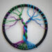 dark rainnbow colors make this little tree of life stand out in the crowd. The hoop is wrapped with black silk cord.